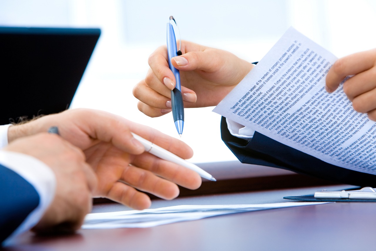 Thinking at desk with documents - Loans for debt review clients: what you must know